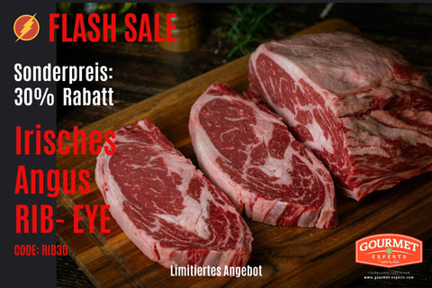 Raw rib eye steaks on a wooden board with a flash sale advertisement overlay.